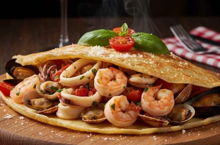 Crespelle italienische Art in einer Variante mit Meeresfrüchten